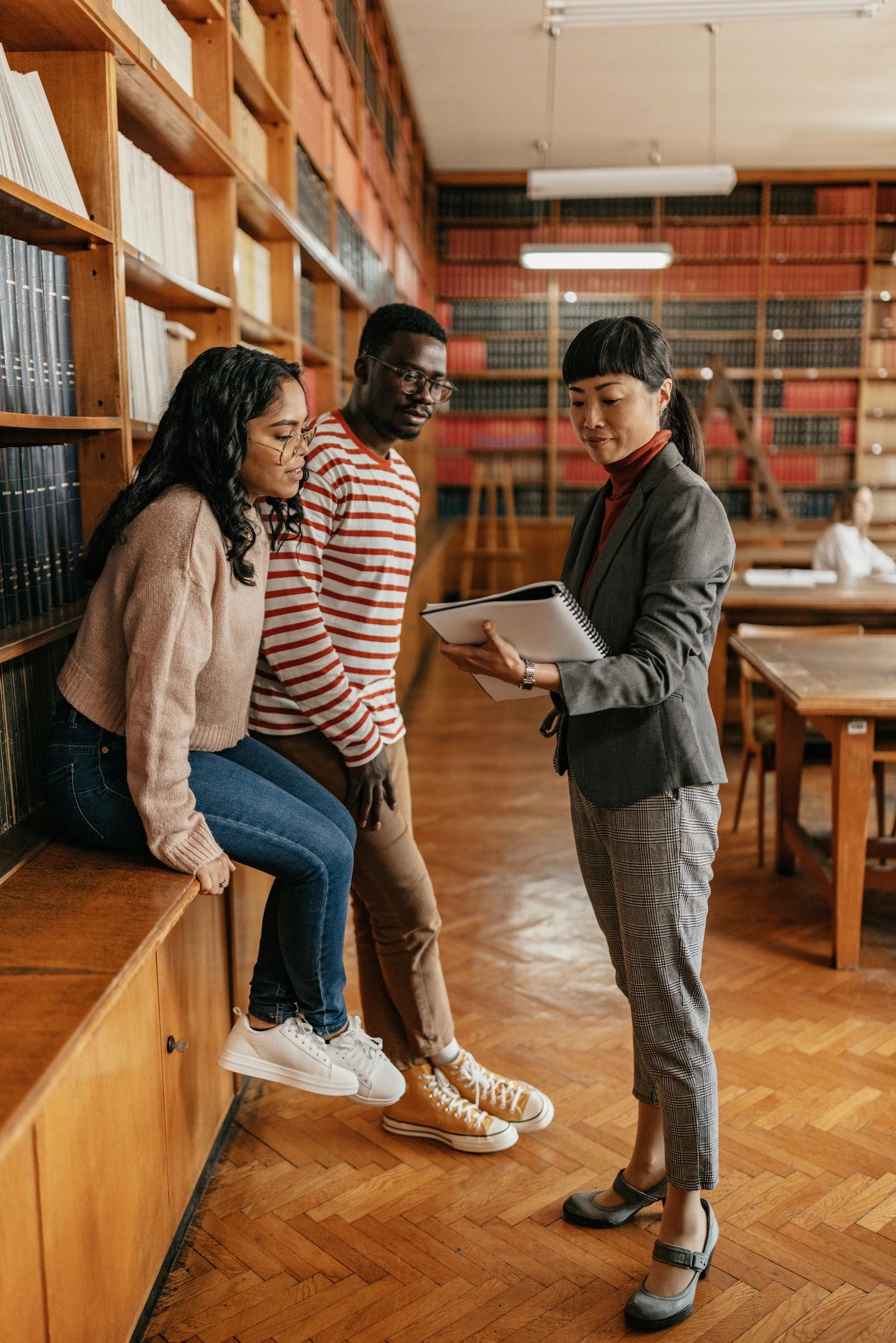 Students collaborating in a library setting
